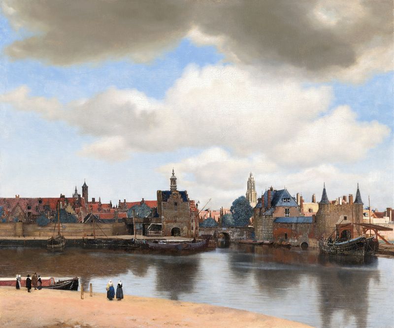 View of Delft by Johannes Vermeer, oil on canvas showing rooftops and water reflections