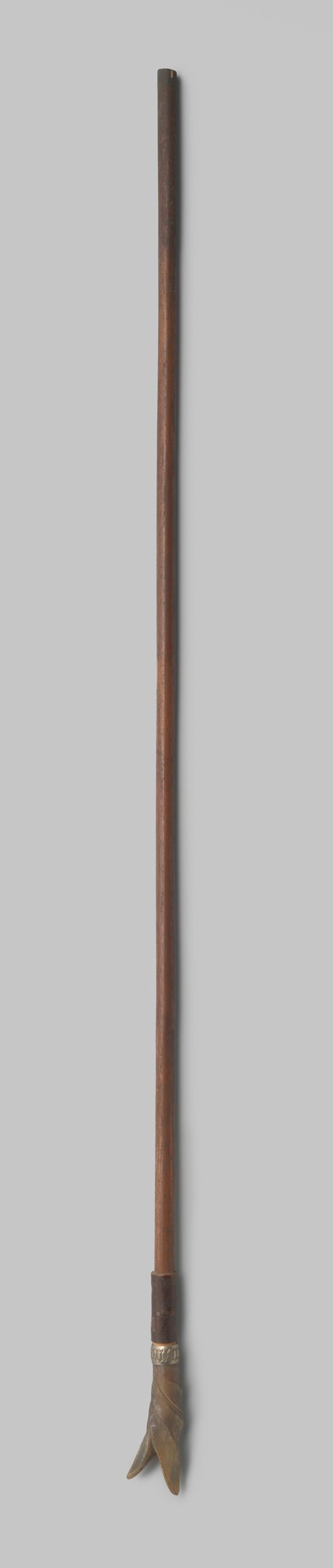 Decorative art piece by Gustav Schnitzler, featuring a parasol handle made of wood and silver.